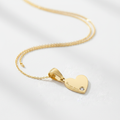 Engraved heart charm on necklace