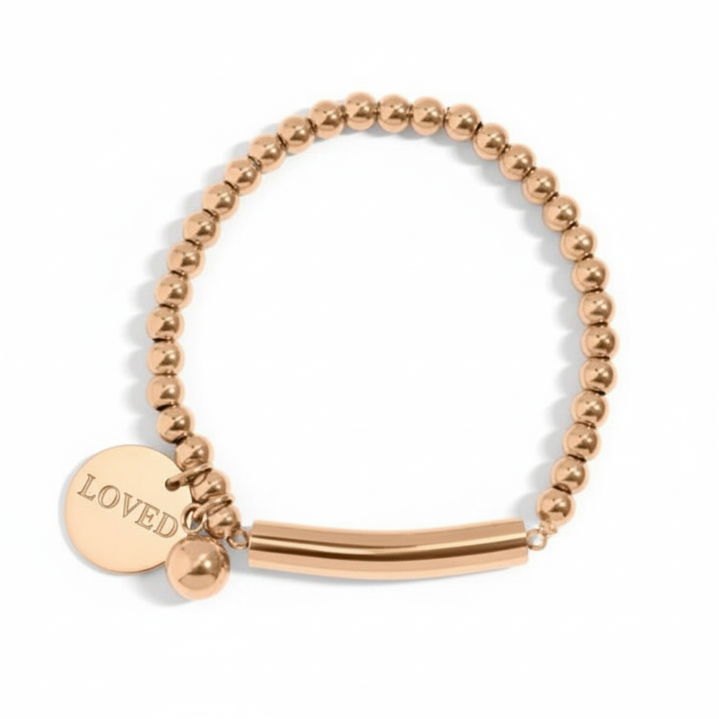 Gold beaded bracelet with LOVED engraving