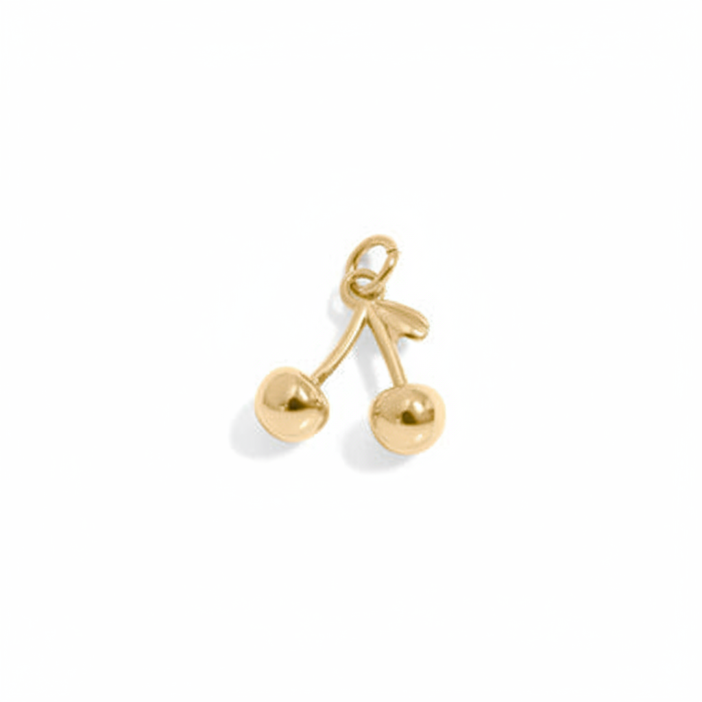 Gold cherry charm on white background