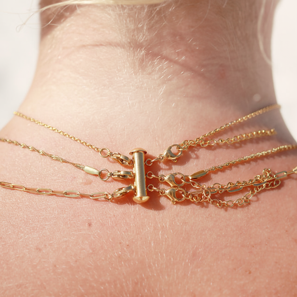 Layered necklaces with neutral skin tone